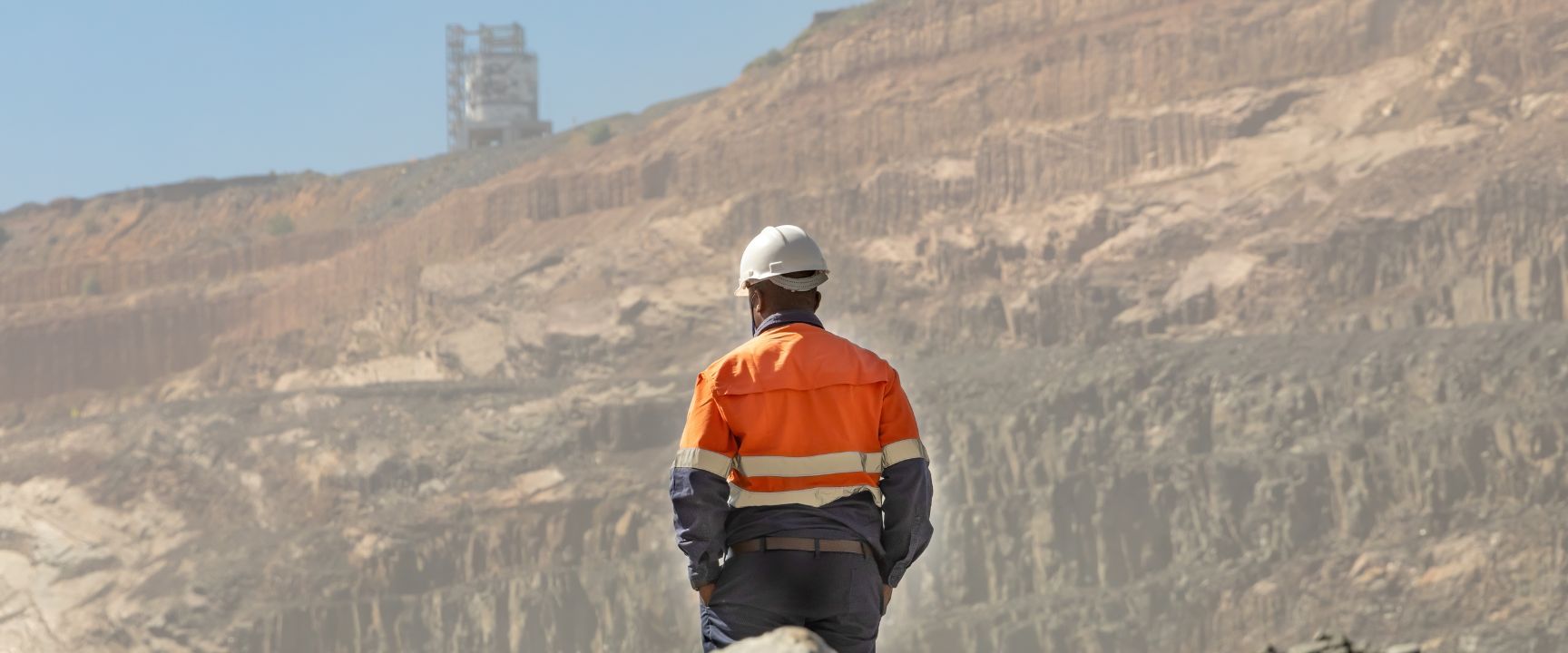 a mining worker overlooking the mines after a landmark ruling regarding public holidays. 